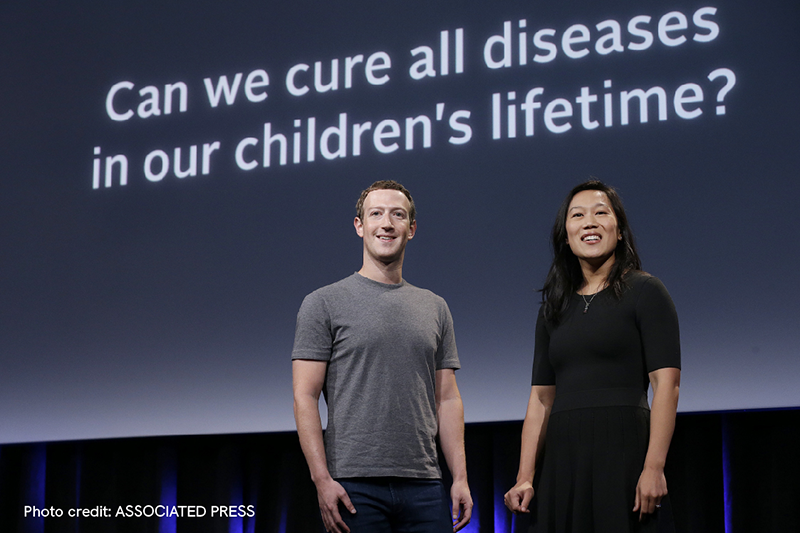 Mark Zuckerberg and Priscilla Chan stand on stage