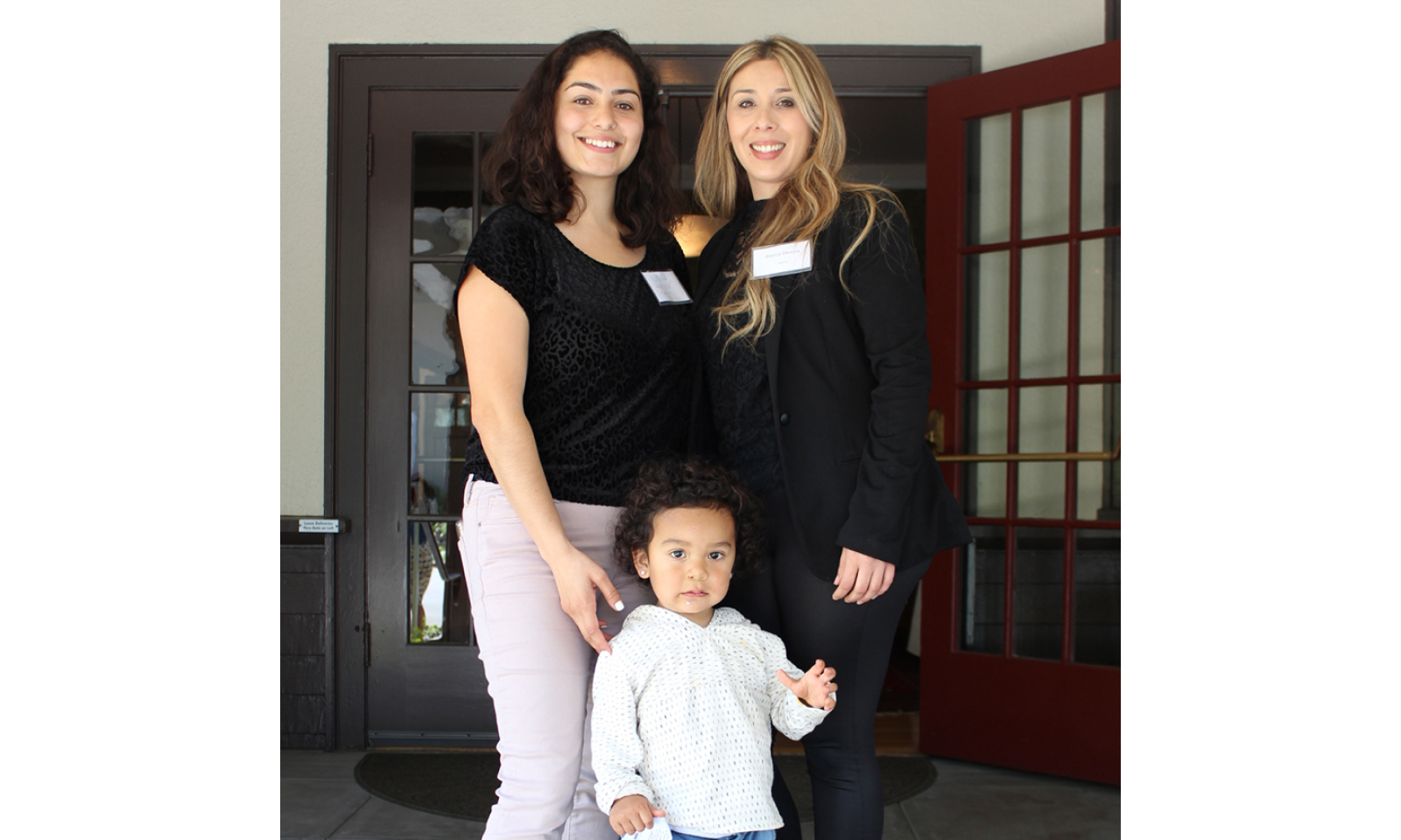 LiveAble graduate Nicole celebrates with her Able Works coach, Blanca Medina, and son, in East Palo Alto. The LiveAble program helps women achieve financial stability, 