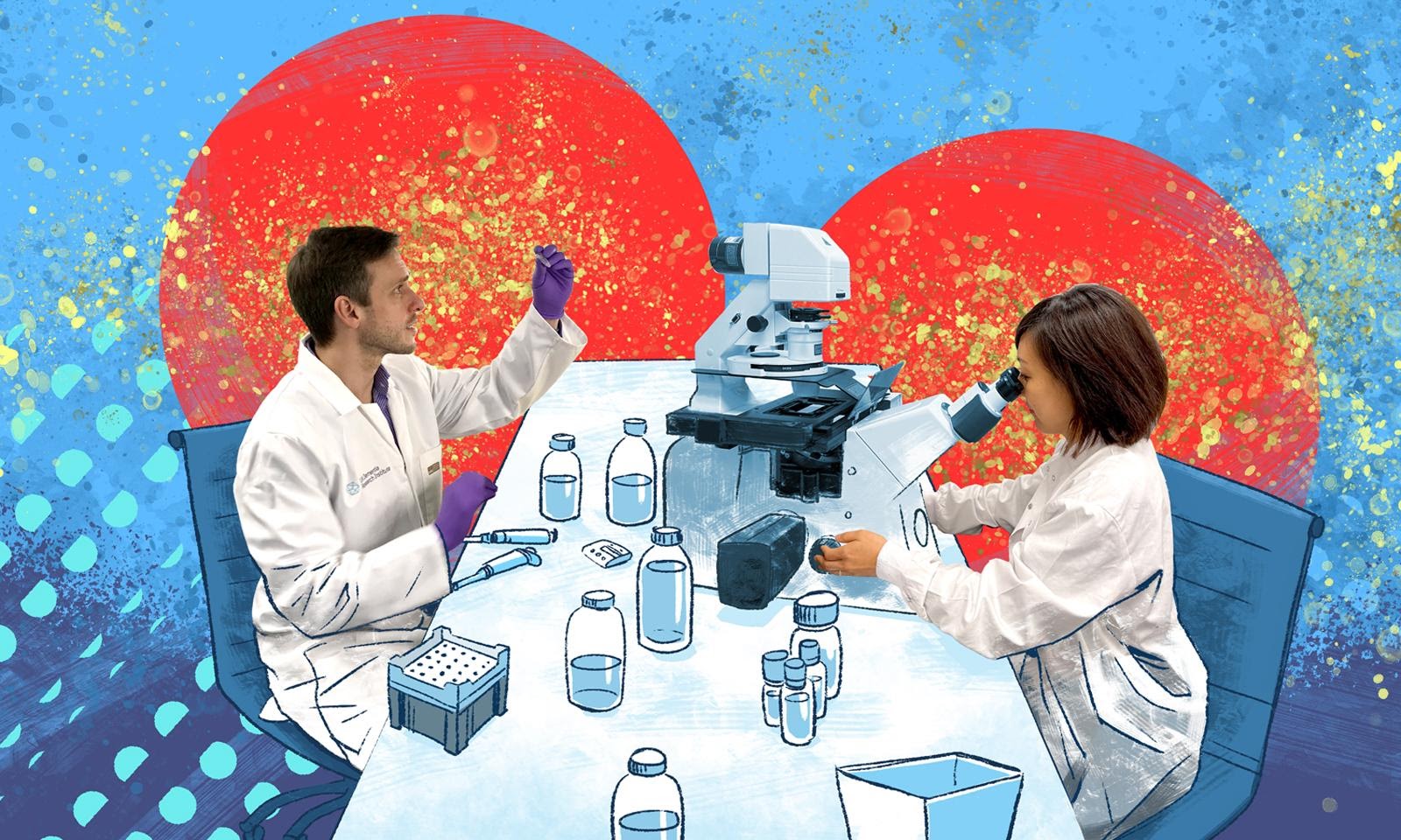 Two scientists work at a lab table and look at samples through a microscope.