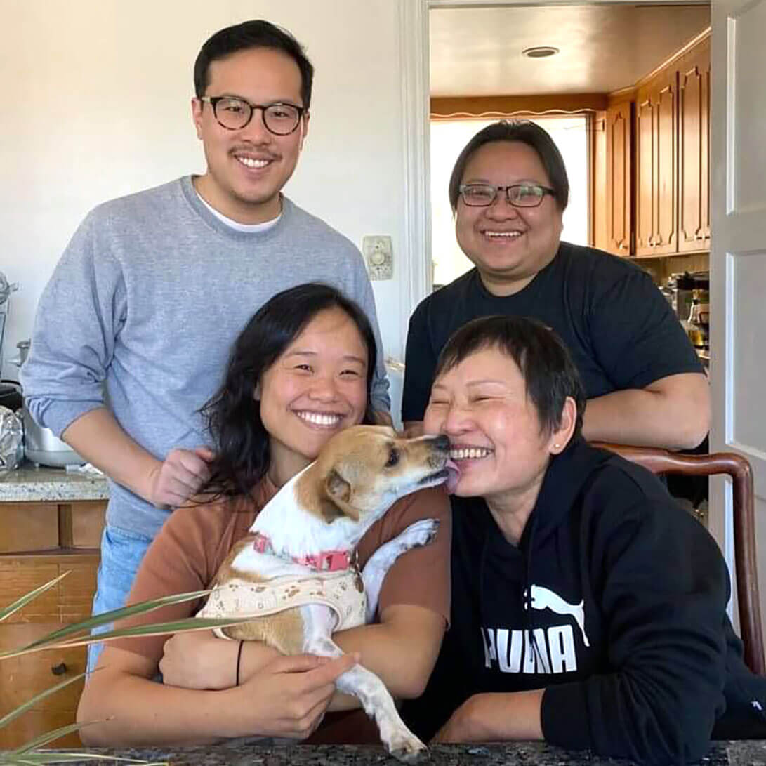 CZI housing affordability manager Michelle with three other smiling people and a dog.