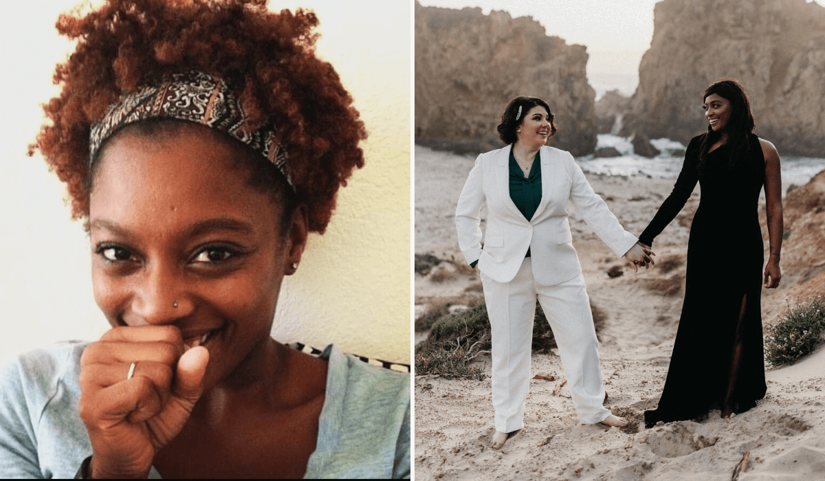 Lacey is a Black woman wearing a black dress. Her wife is a white woman and is wearing an off-white pant suit. They are holding hands barefoot on the beach.