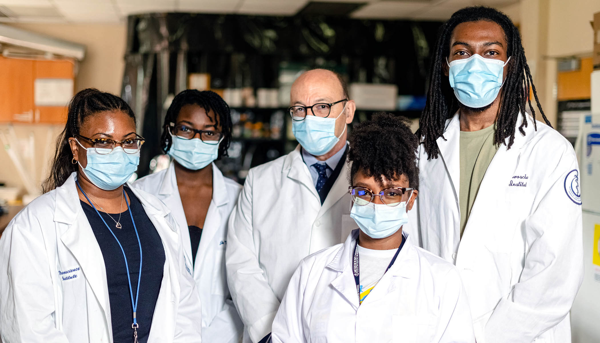 A group of Morehouse researchers wearing masks in a lab.