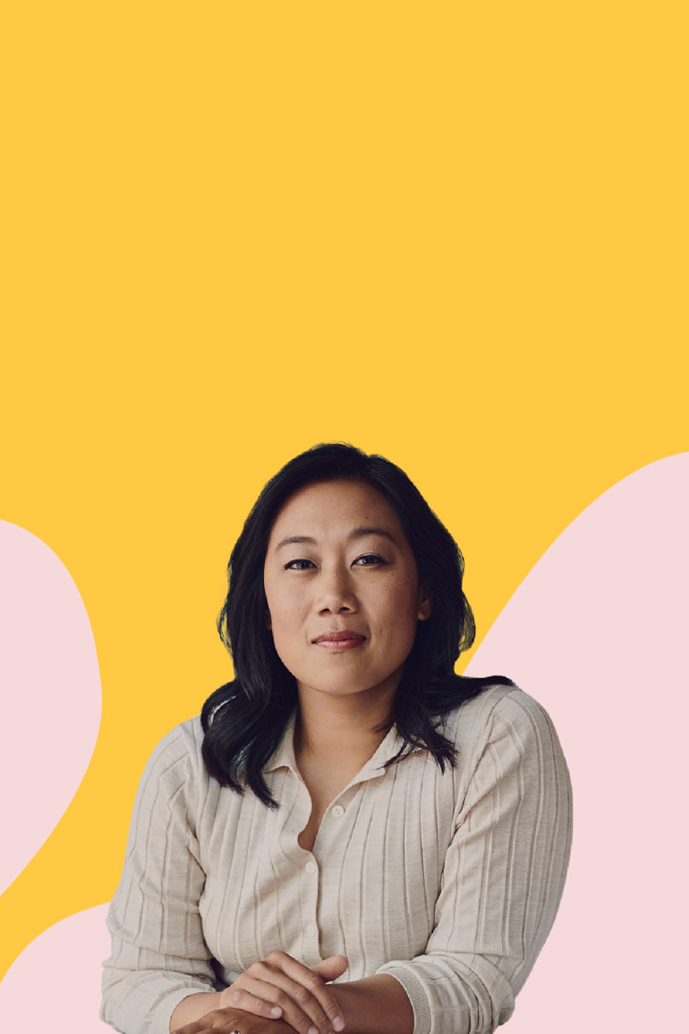 Priscilla Chan, co-CEO of the Chan Zuckerberg Initiative, looking at the camera with her arms folded and in front of a yellow and pink illustrated background.