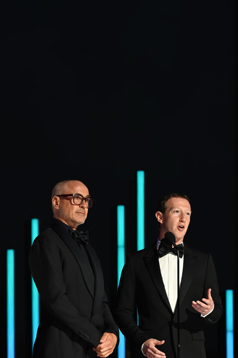 Mark Zuckerberg and Robert Downey Jr. stand on stage and present the Breakthrough Prize in Life Sciences