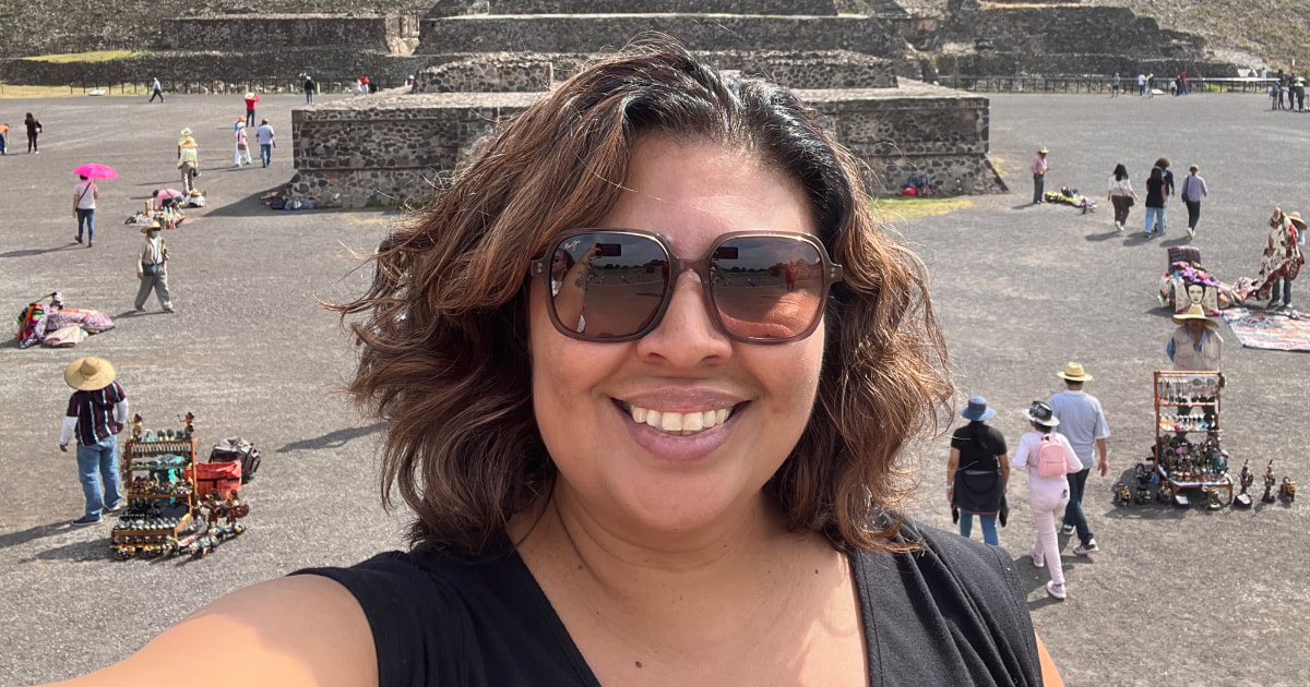 Rosa Cabrera smiles for a selfie in front of Teotihuacan — Aztec ruins outside of Mexico City