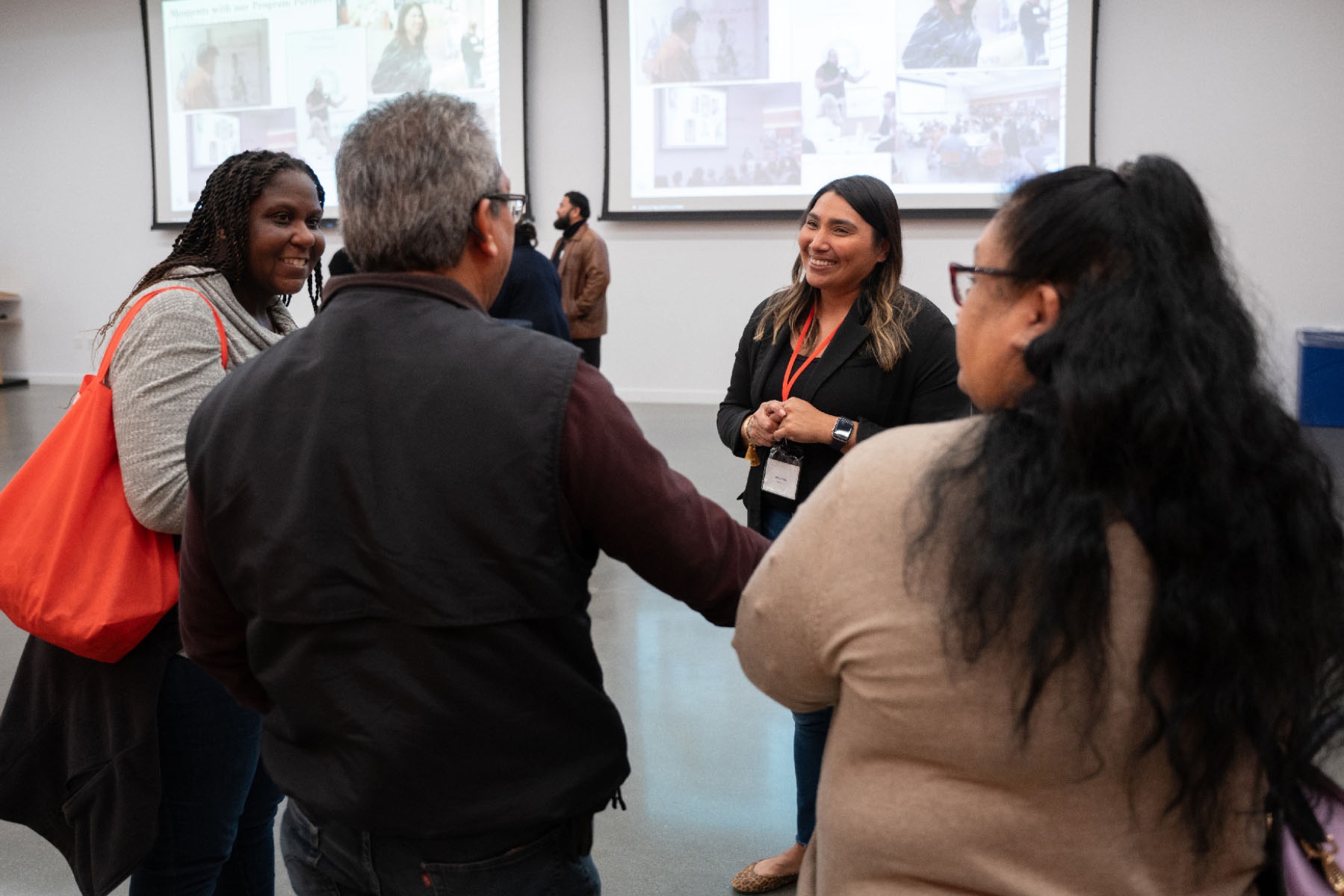 Community Affairs Programs Officer Alma Pulido chats with guests during an Open House in the CZI Community Space.