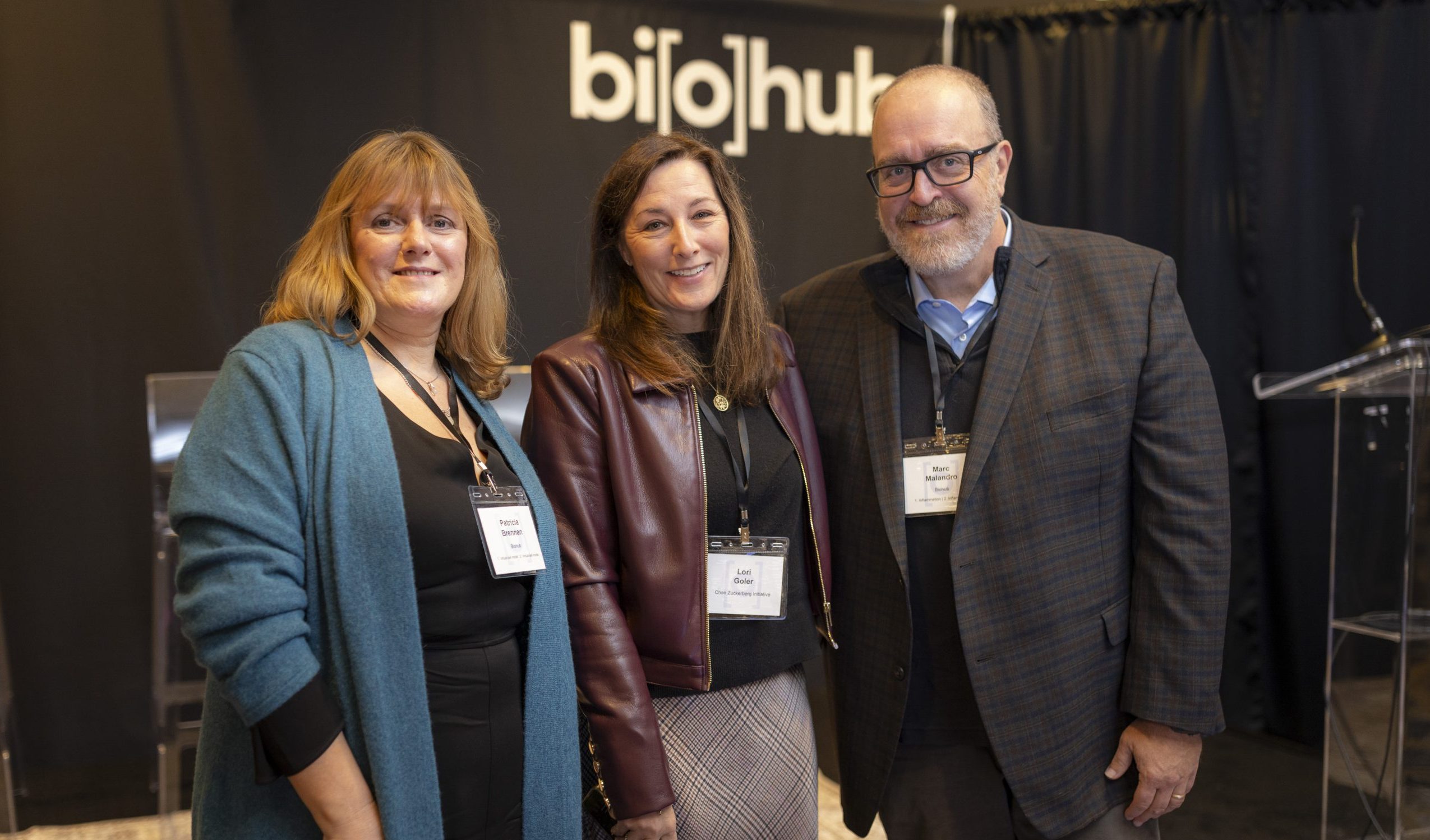 Leaders of Biohub attending the Biohub Affiliate Symposium smiling in the main ballroom of the Martinique New York on Broadway in New York City, NY.
