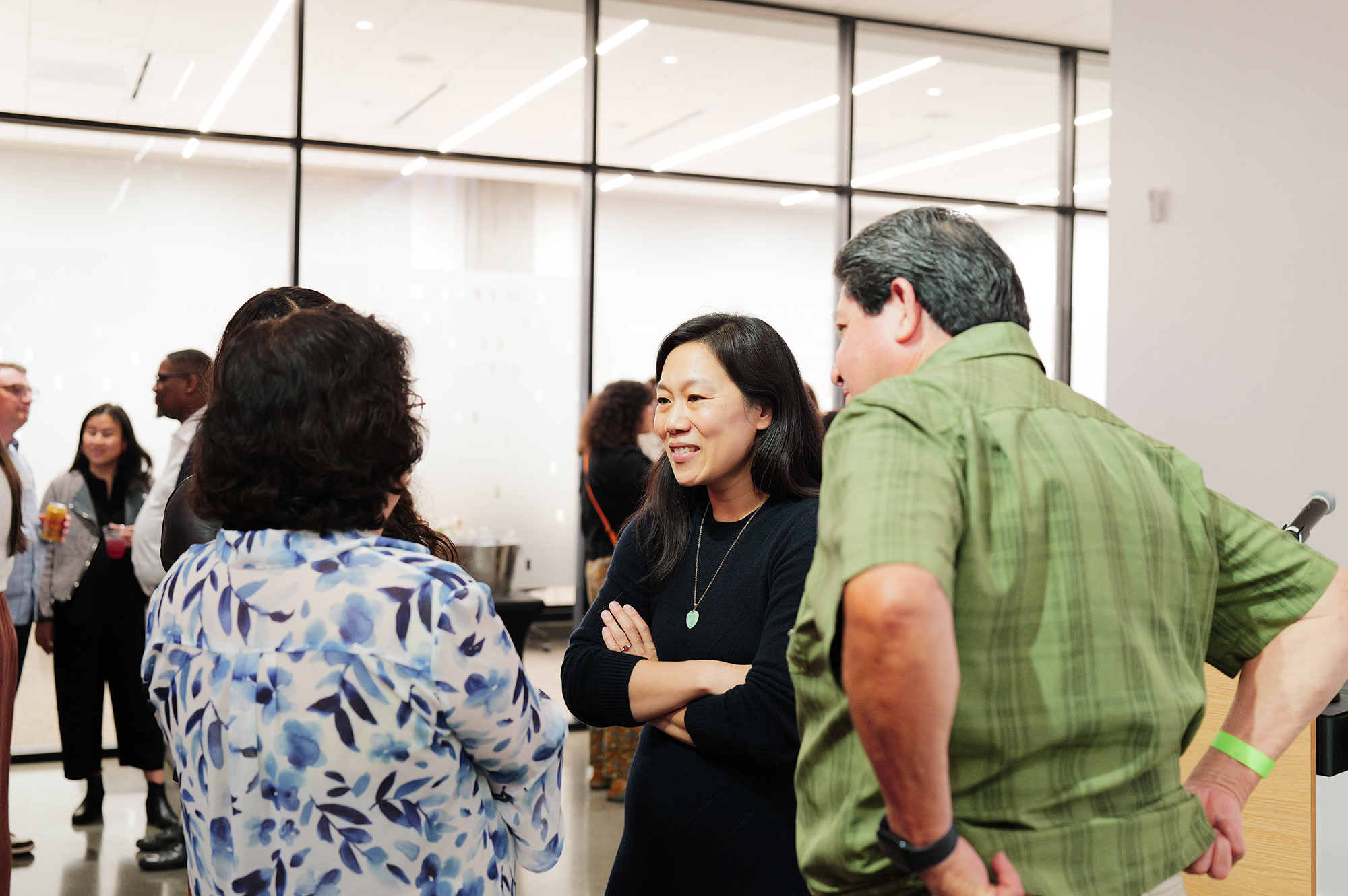 Priscilla Chan speaks with grantees at a Community Space reception.