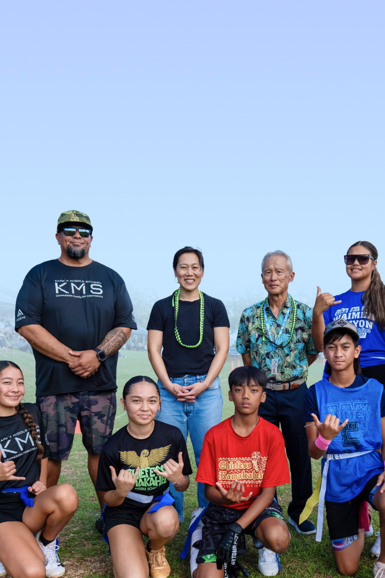 Priscilla Chan with student athletes and staff from Kauaʻi middle schools, marking a decade of CZI philanthropy in Hawaii.