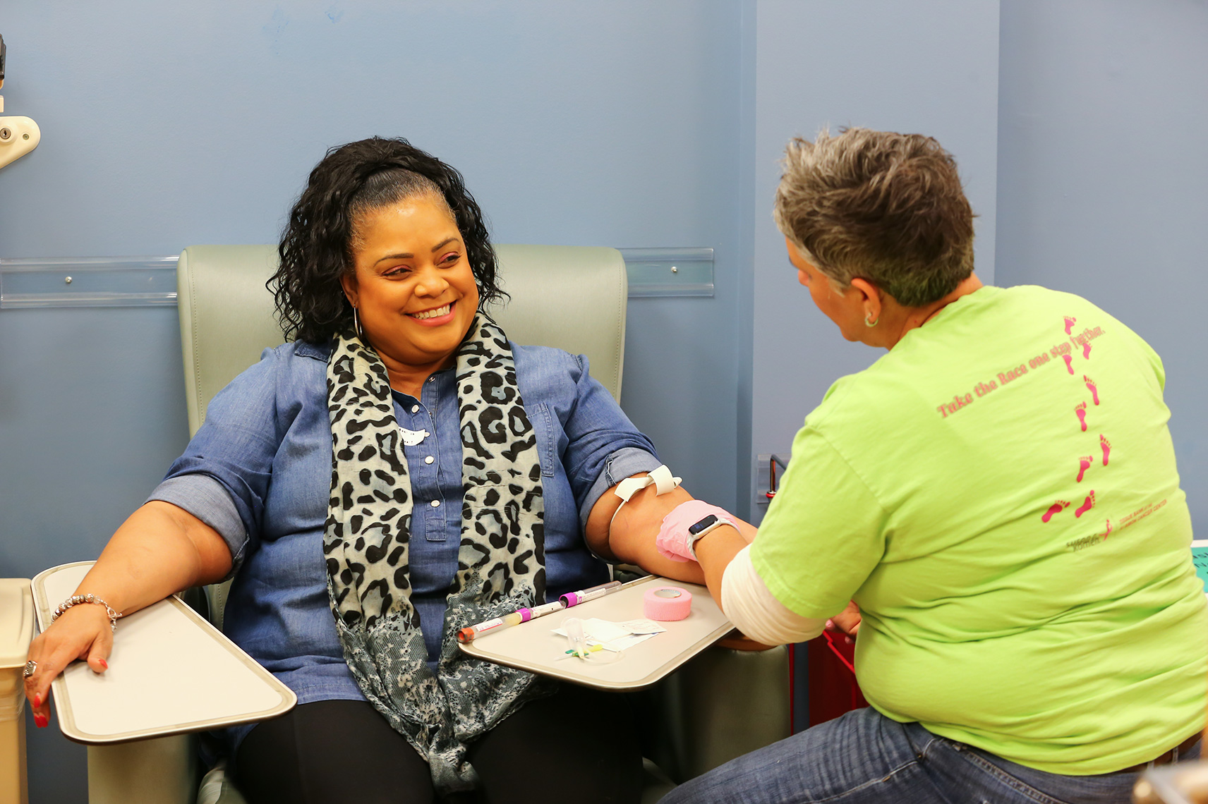 Volunteer collecting tissue sample from a woman