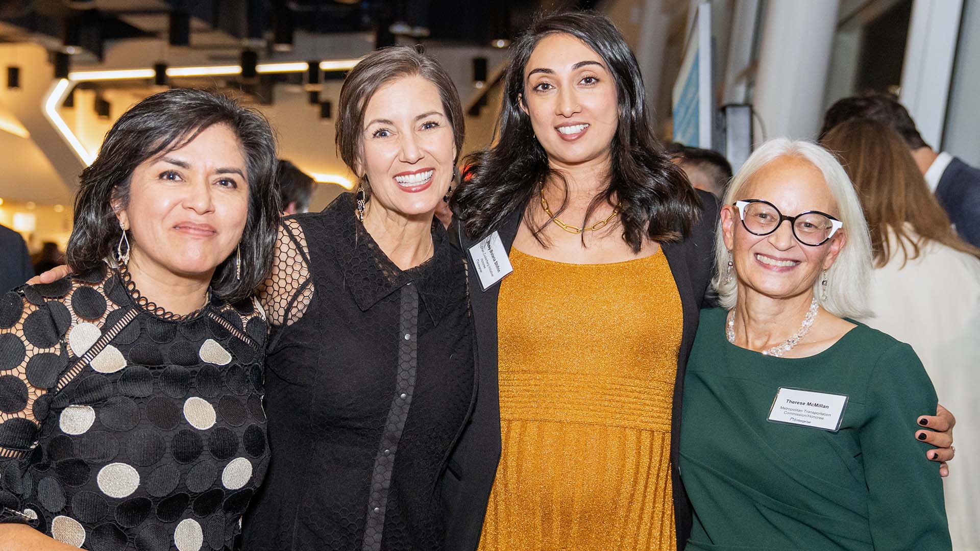 A group poses for a photo at an event.