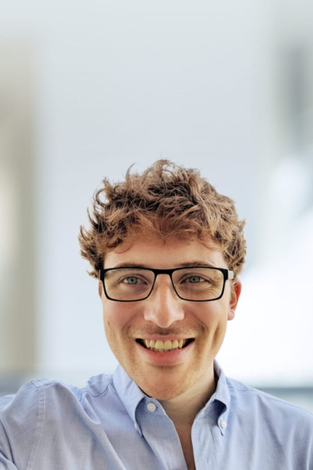 A smiling photo of Ambrose Carr, senior director of data at CZI.